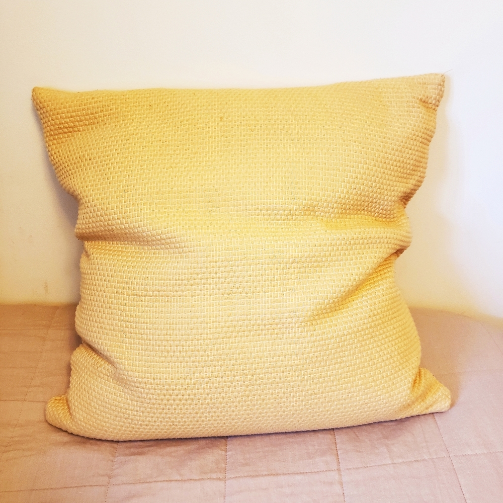 Yellow throw pillow